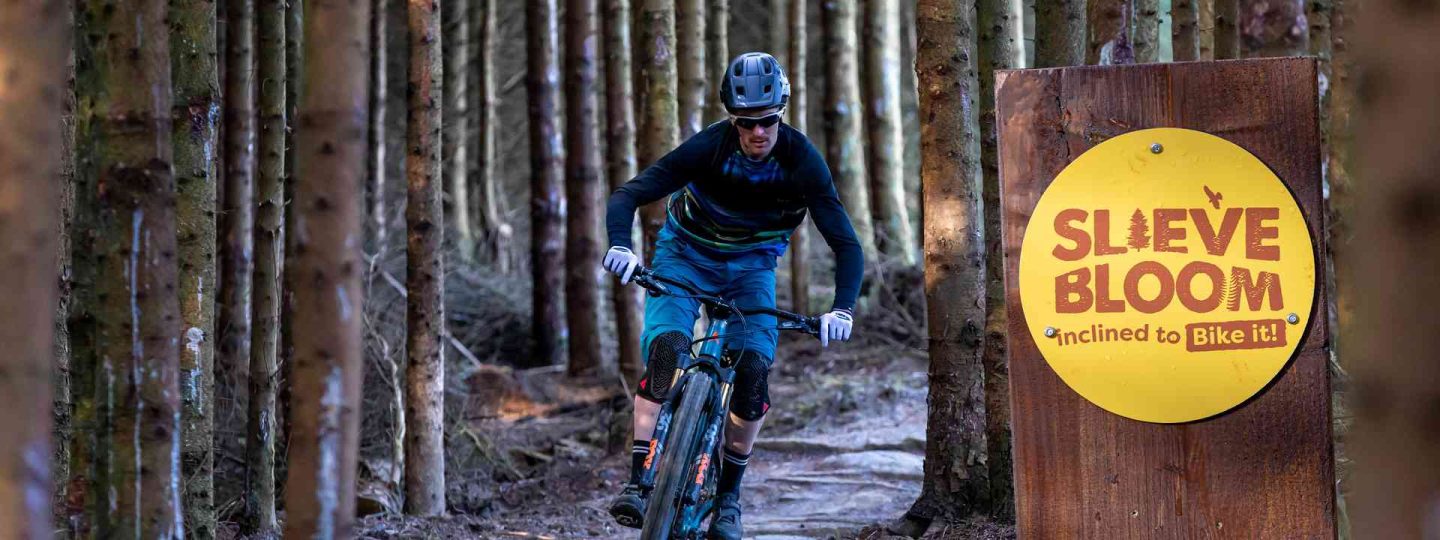 Person mountain biking